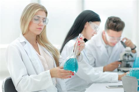 Group Of Scientists Conduct Research In The Laboratory Stock Photo