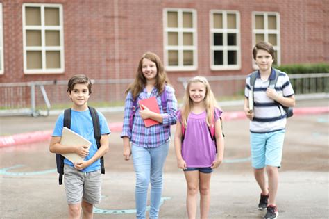 Elementary Student Friends Walking To Class Stock Photo - Download ...