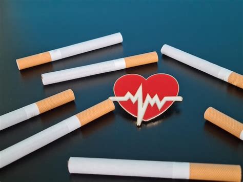 Premium Photo | Heart and cigarettes and smoking and cardiovascular disease