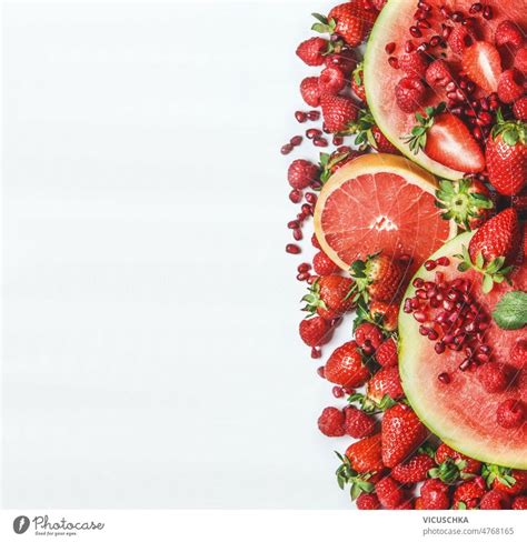 Red fruits and berries on white background. Watermelon, grapefruit ...