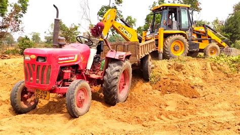 New Jcb Dx Backhoe Machine Loading Mud In Mahindra Di Tractor