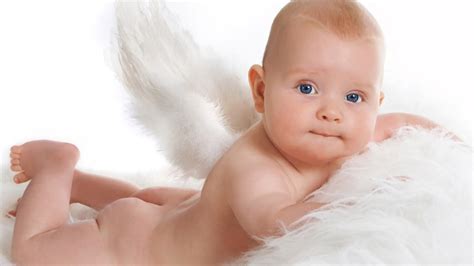 Chubby Blue Eyes Cute Baby Child Is Lying On White Fur Cloth In White