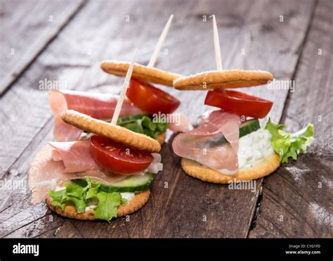 Crackers With Ham Cream Cheese And Vegetables Stock Photo Alamy