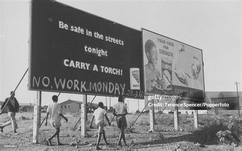 Local Residents Walk Past A Billboard Amended To Advertise A Day Of News Photo Getty Images