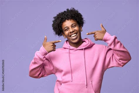 Happy African American teen guy pointing at dental white teeth ...