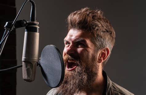 Premium Photo Singing Man In A Recording Studio Expressive Bearded