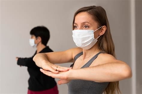 Premium Photo Women Exercising With Face Masks