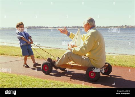 Kid pulling go kart hi-res stock photography and images - Alamy