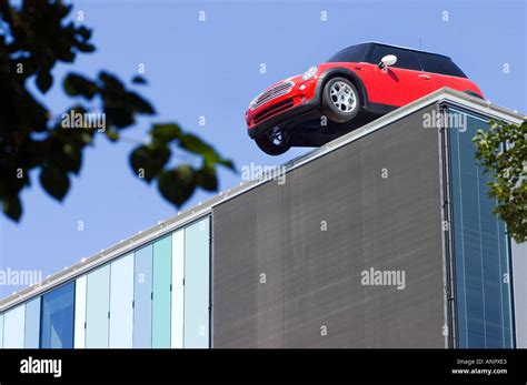 Oh Oops whoops red car MINI parking on a roof humour fun funny silly ...