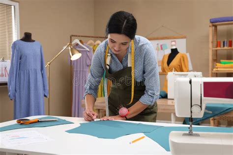 Dressmaker Marking Fabric With Chalk In Workshop Stock Photo Image Of