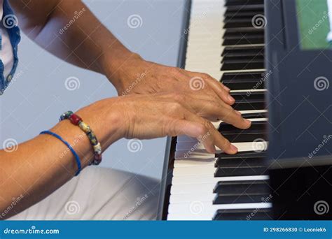 Human Hands Playing the Keys Notes and Chords on a Classic Black Piano ...