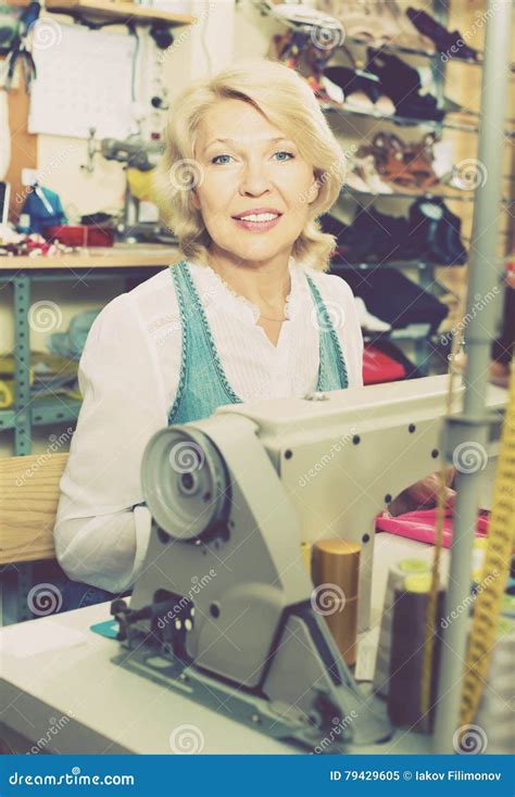 Friendly Mature Woman Tailor Using Sewing Machine Stock Image Image