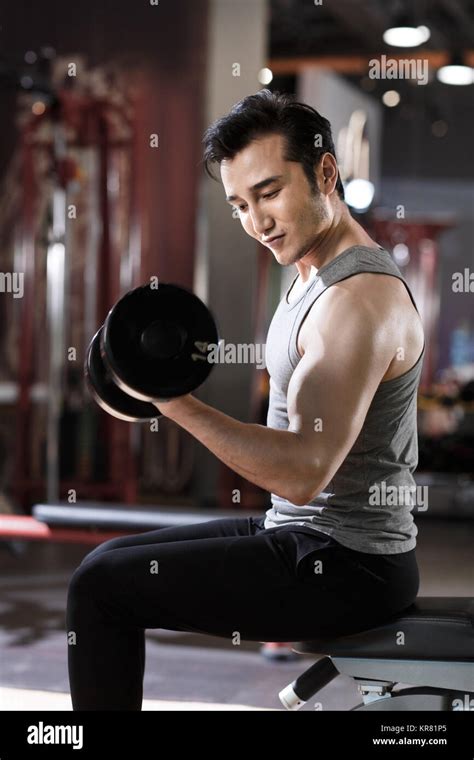 young men exercise   gym stock photo alamy