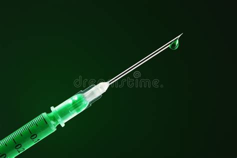 Syringe Filled With Drug And Dripping From The Needle Stock Image ...