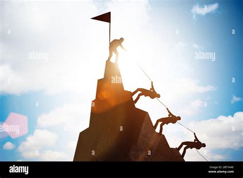 Concept of teamwork with team climbing mountain Stock Photo - Alamy