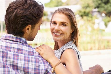 Couple Portrait And Bonding On Love Bench In Nature Park Or City