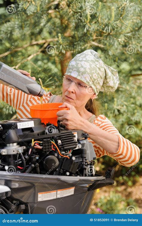 Woman Pouring Oil Into Outboard Motor Stock Image Image Of Scarf