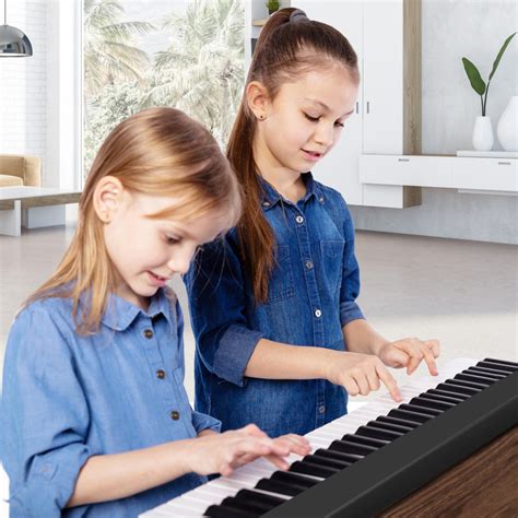 61-Key Folding Piano Keyboard with Full Size Keys and Music Stand - Costway