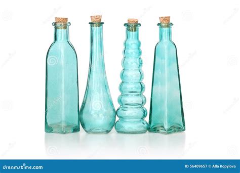 Four Cyan Colored Glass Bottles Of Different Shapes Stock Image Image