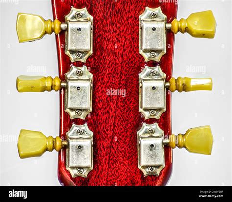 Closeup Of Guitar Tuner Or Tuning Pegs On Red Headstock Classic Old