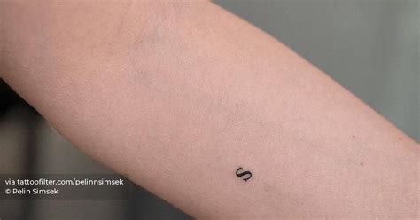 Minimalistic Style Tattoo Of The Letter S Located On