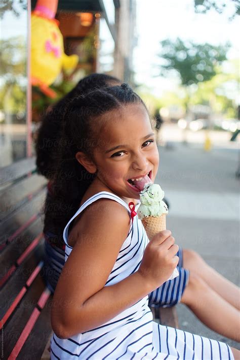 Young Sisters Eating Ice Cream By Stocksy Contributor Chelsea