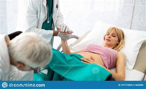 In The Hospital Woman In Labor Pushes To Give Birth Obstetricians