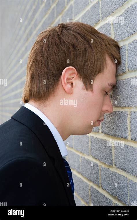 Businessman With Head Against Brick Wall Stock Photo Alamy