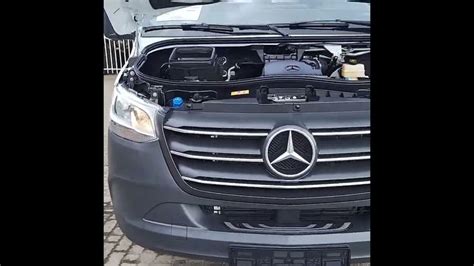 The Front End Of A Car With Its Hood Open