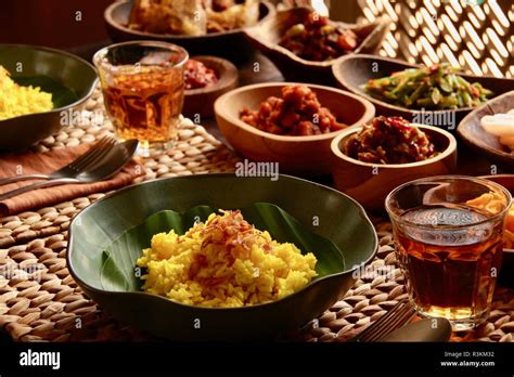 Nasi Kuning Traditional Indonesian Yellow Turmeric Rice Accompanied With Several Side Dishes