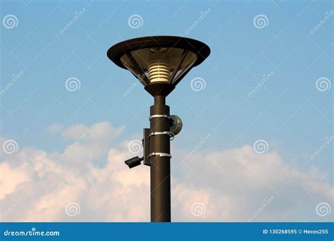 Modern Street Lamp Post With LED Lightning And Surveillance Camera With