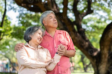 Portrait Of Lovely Elderly Couple Hugging Each Other With Love And