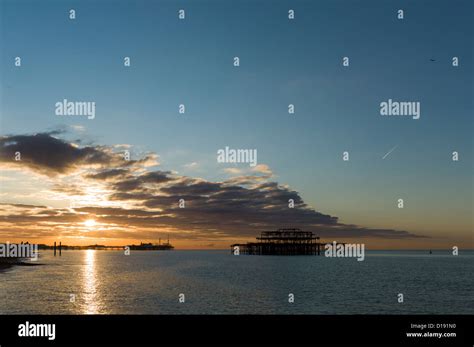 Brighton Piers Sunrise Stock Photo Alamy