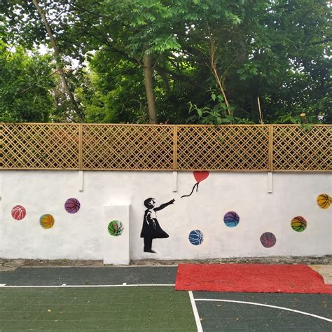 Outdoor basketball mural by Val in London