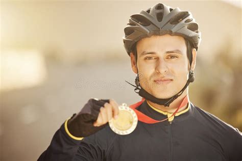 Cycling Helmet And Medal With A Sports Man After A Race As A Winner