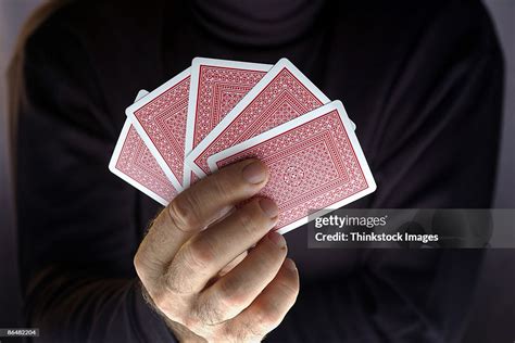 Hand Holding Playing Cards High Res Stock Photo Getty Images