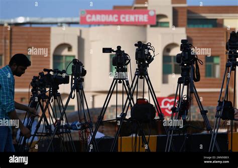 A Journalist Adjusts His Camera Outside The Cardiac Ward Where Jailed