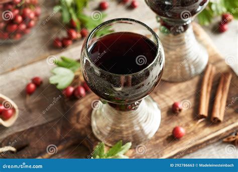 Medicinal Wine Made Of Fresh Hawthorn Berries In Vintage Glass Cups