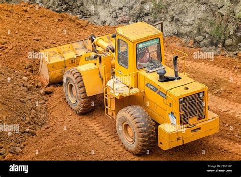 Excavator Digging Soil In The Construction Site Stock Photo Alamy