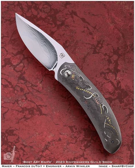 A Knife With An Intricate Design On The Blade Is Shown In Front Of A