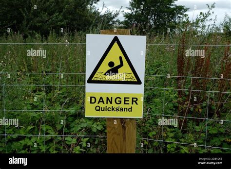 quicksand sign danger high resolution stock photography  images alamy