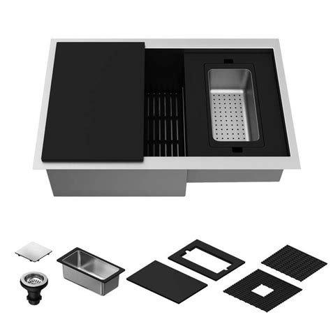 A Kitchen Sink With Black And White Accessories Including A Drainer