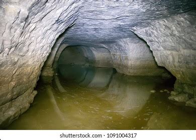 Partially Flooded Underground Caves Catacomb Journey Stock Photo