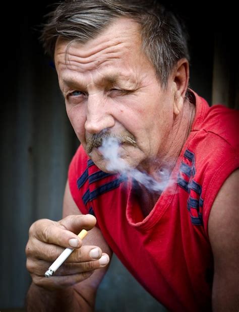 Premium Photo Close Up Of Man Smoking Cigarette