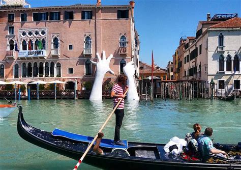 Contemporary Sculpture by Lorenzo Quinn Emerges from Venice's Lagoon