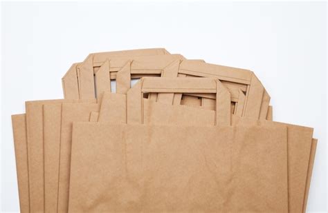 Premium Photo High Angle View Of Paper Bags On White Background