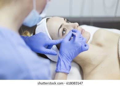 Beautician Touch Draw Correction Lines On Stock Photo