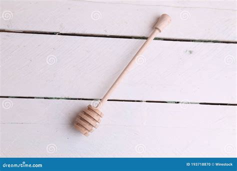 Overhead Shot of a Honey Wand on a White Wooden Surface Stock Photo ...