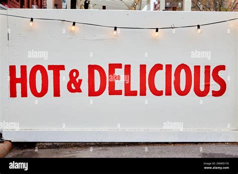 Hot And Delicious Sign With String Of Lights Stock Photo Alamy