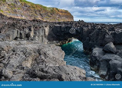 Selective Focus In Lava Stones By The Sea And Forming A Small Bridge At